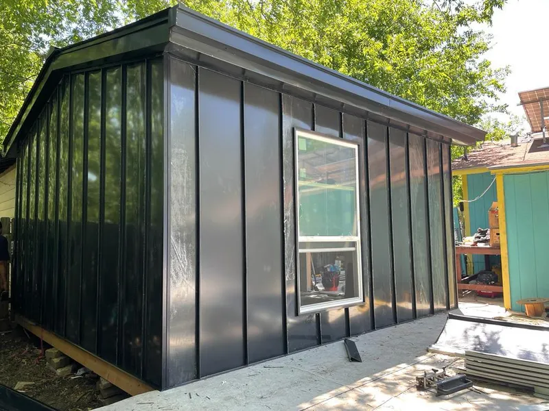 Black standing seam metal wall panels for Roof Inspection in Fowler