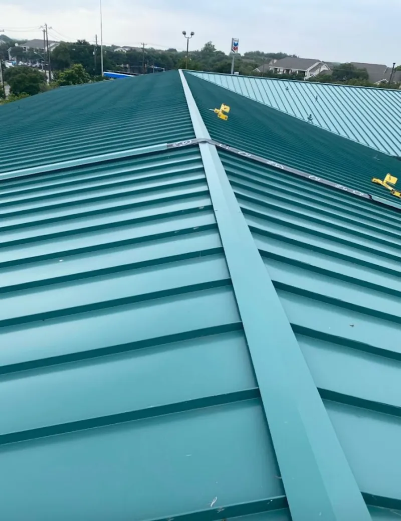 Green commercial metal roof ridge and valley for Metal Roof Repair in Fowler